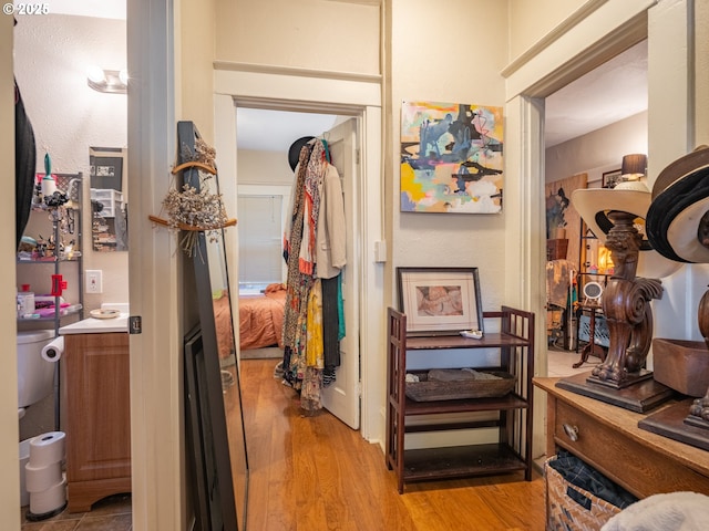 hall with light hardwood / wood-style floors