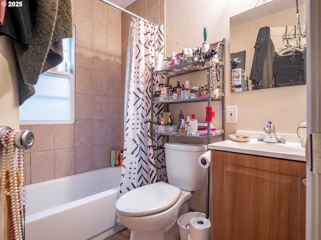 full bathroom with vanity, shower / bath combo with shower curtain, and toilet