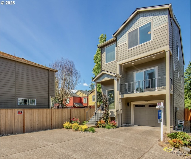 3037 SW Sherman Pl, Beaverton, OR 97003 - view of front of home with concrete driveway, an attached garage, and a balcony