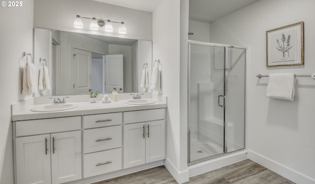 3037 SW Sherman Pl, Beaverton, OR 97003 - full bath with a shower stall, wood finished floors, and double vanity
