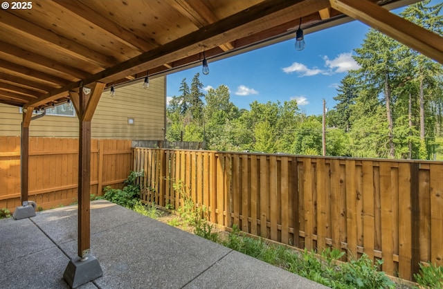 3037 SW Sherman Pl, Beaverton, OR 97003 - fenced backyard with a patio area