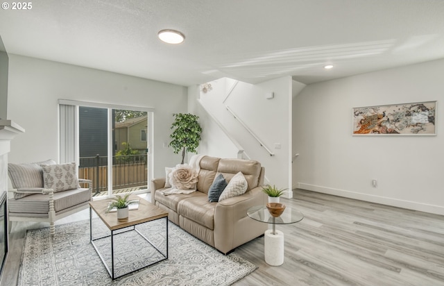 3037 SW Sherman Pl, Beaverton, OR 97003 - living area featuring wood finished floors, stairway, recessed lighting, and baseboards