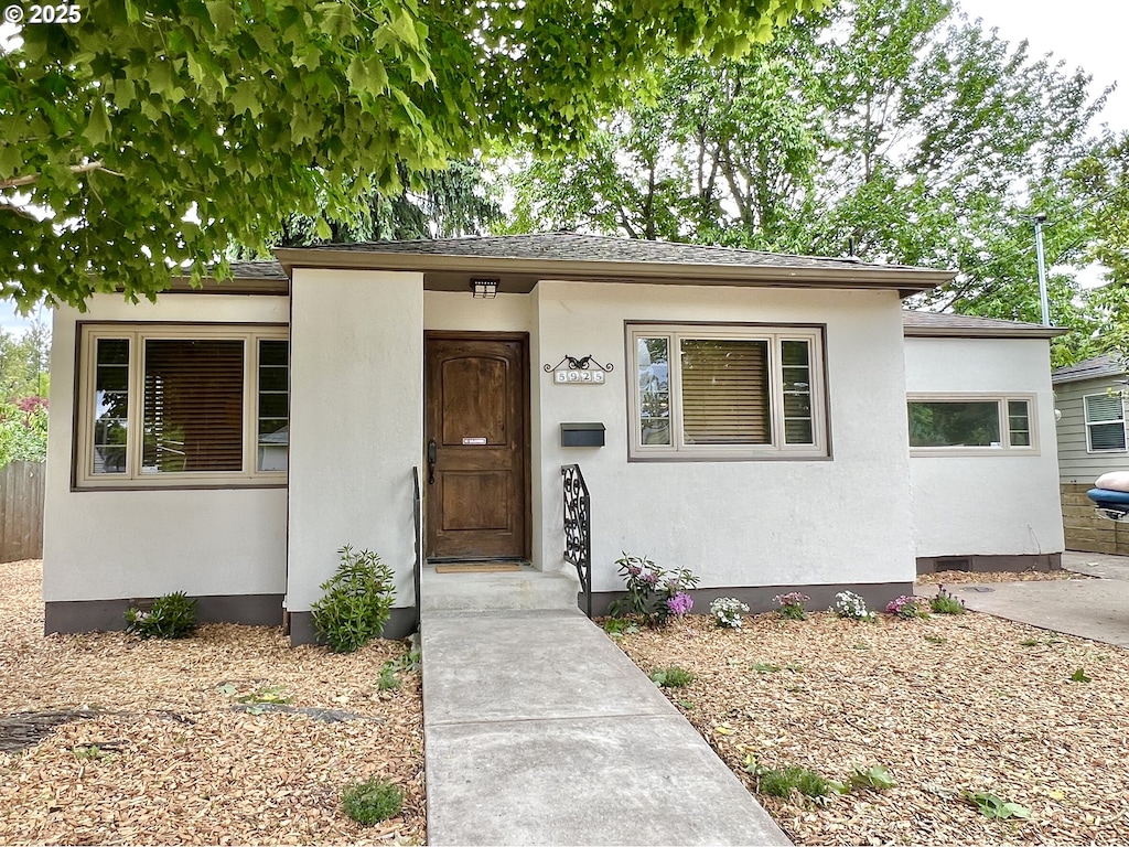 view of front of house featuring stucco siding
