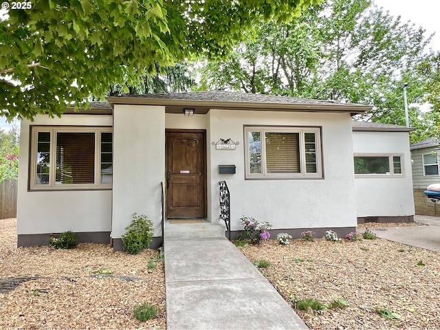 view of front of house featuring stucco siding