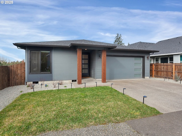 prairie-style home featuring a front yard, an attached garage, fence, and driveway