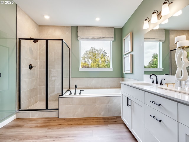 13009 NE 111th St, Vancouver, WA 98682 - bathroom featuring a garden tub, a stall shower, healthy amount of natural light, vanity, and recessed lighting