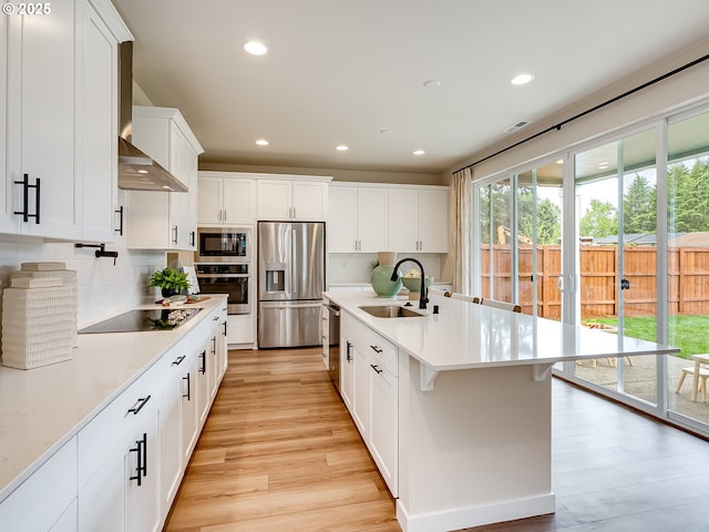 13009 NE 111th St, Vancouver, WA 98682 - kitchen featuring stainless steel appliances, light countertops, white cabinets, backsplash, and recessed lighting