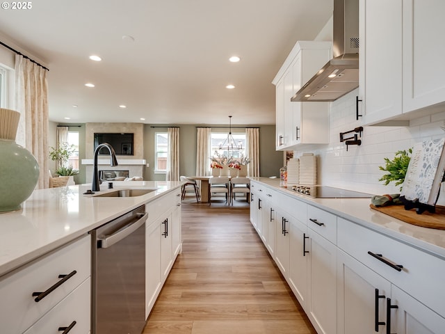 13009 NE 111th St, Vancouver, WA 98682 - kitchen featuring stainless steel dishwasher, wall chimney exhaust hood, light wood-style flooring, light countertops, and recessed lighting