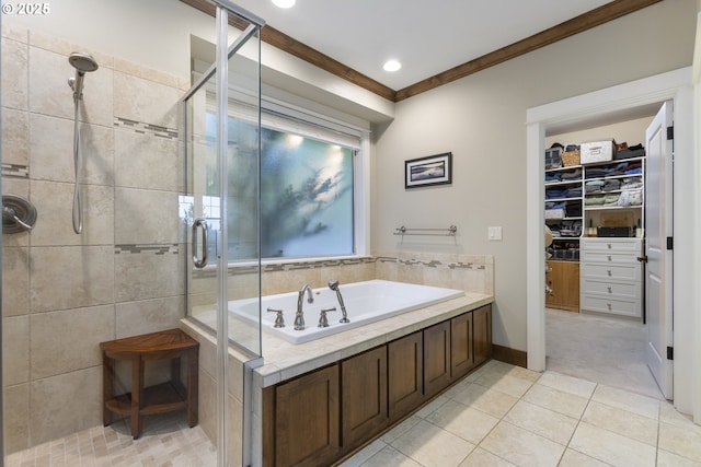 10137 SW Lancaster Rd, Portland, OR 97219 - bathroom featuring a stall shower, a garden tub, a spacious closet, tile patterned flooring, and crown molding