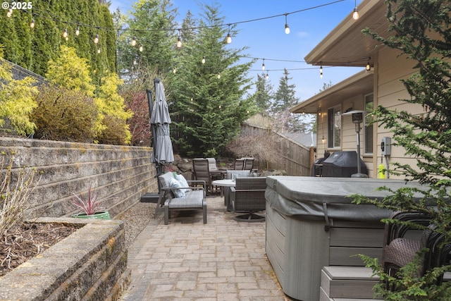 10137 SW Lancaster Rd, Portland, OR 97219 - fenced backyard featuring a hot tub, a patio, outdoor lounge area, and grilling area