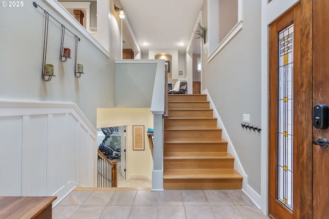 10137 SW Lancaster Rd, Portland, OR 97219 - staircase featuring tile patterned floors and recessed lighting