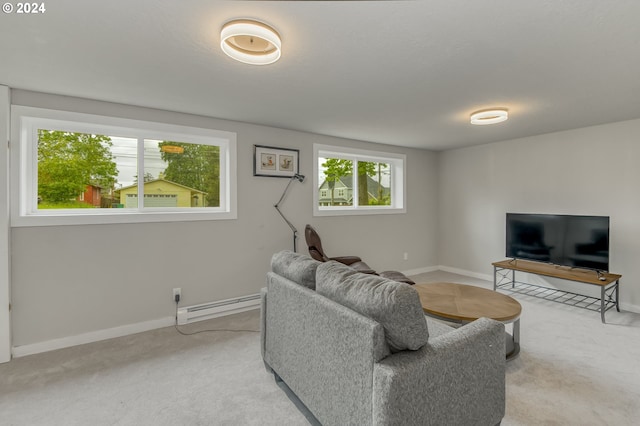 carpeted living room featuring a baseboard heating unit