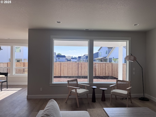 844 NE 17th Ave, Canby, OR 97013 - dining space featuring wood finished floors, baseboards, a textured ceiling, and recessed lighting