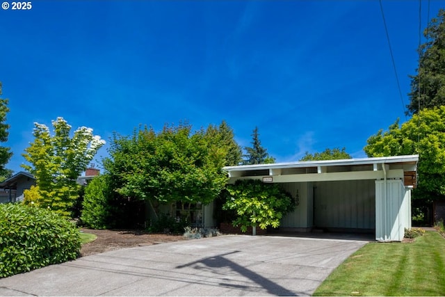 1439 Barton St, Eugene, OR 97404 - view of front of home featuring an attached carport and concrete driveway