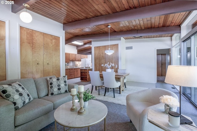 1439 Barton St, Eugene, OR 97404 - living area with wooden ceiling with exposed beams and carpet