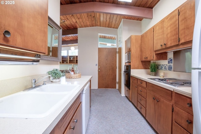 1439 Barton St, Eugene, OR 97404 - kitchen with wooden ceiling, a sink, appliances with stainless steel finishes, light countertops, and light carpet