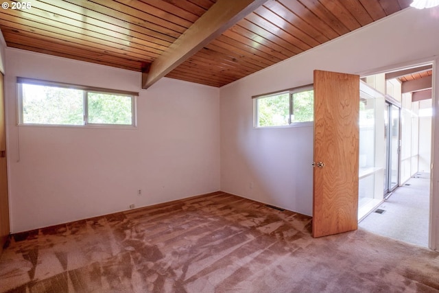 1439 Barton St, Eugene, OR 97404 - empty room with carpet flooring and wood ceiling with exposed beams