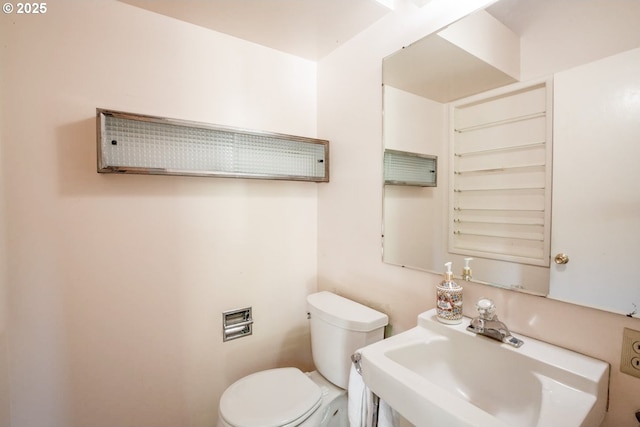 1439 Barton St, Eugene, OR 97404 - half bathroom with a sink and toilet