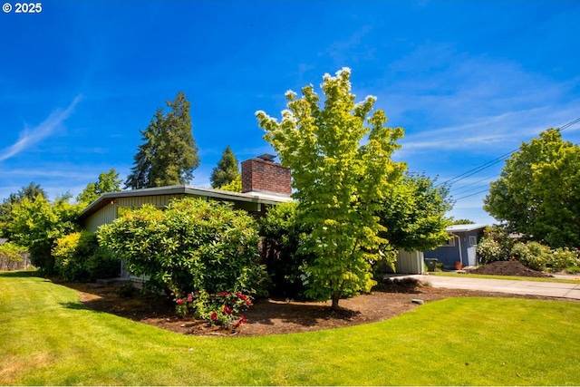 1439 Barton St, Eugene, OR 97404 - view of front of home with a chimney and a front yard