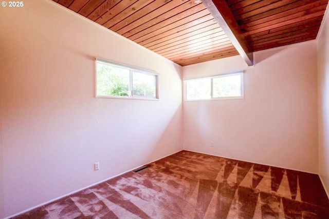 1439 Barton St, Eugene, OR 97404 - carpeted spare room with wooden ceiling with exposed beams