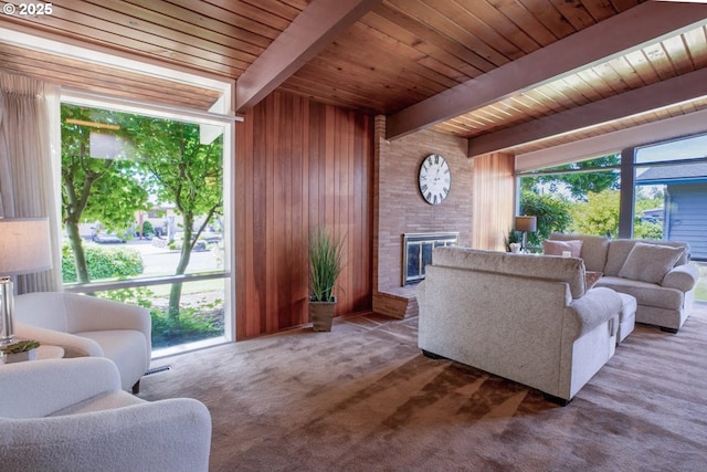 1439 Barton St, Eugene, OR 97404 - living room with wooden ceiling with exposed beams, a fireplace, wood walls, and carpet flooring