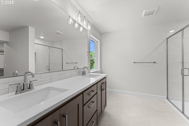 16401 SW Cambridge Ln, Durham, OR 97224 - bathroom with double vanity, a stall shower, and baseboards