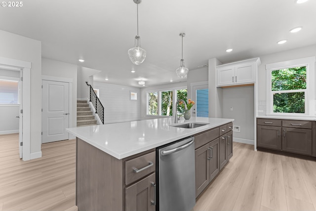 16401 SW Cambridge Ln, Durham, OR 97224 - kitchen featuring dishwasher, a sink, light wood-type flooring, light countertops, and recessed lighting
