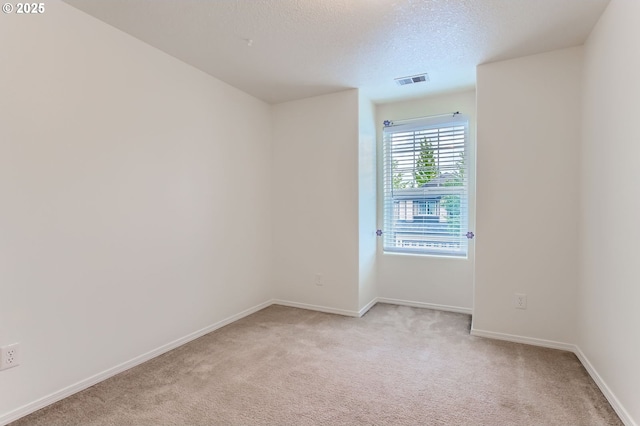 20372 SW Verona Ct, Beaverton, OR 97003 - empty room featuring light colored carpet and a textured ceiling