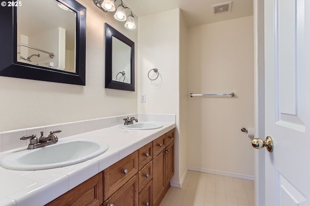 20372 SW Verona Ct, Beaverton, OR 97003 - bathroom featuring double vanity and baseboards