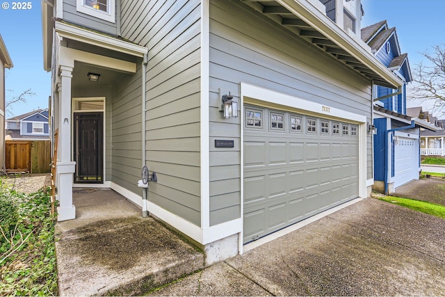 view of side of home featuring a garage