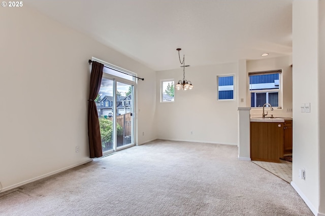 20372 SW Verona Ct, Beaverton, OR 97003 - spare room with light colored carpet and a chandelier