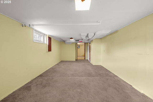 below grade area featuring carpet flooring