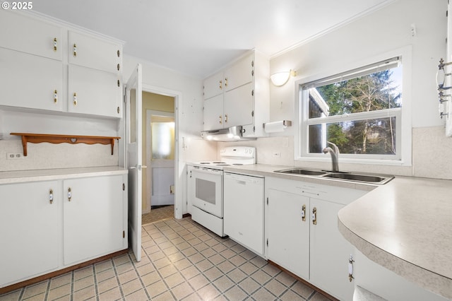 kitchen with light countertops, white appliances, white cabinetry, and a sink