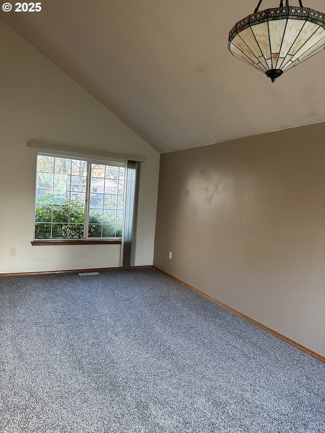 14237 SE Lee Ave, Milwaukie, OR 97267 - carpeted spare room featuring baseboards and vaulted ceiling