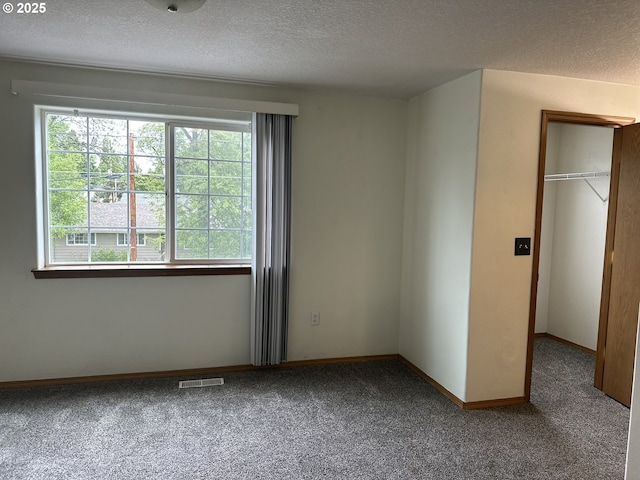 14237 SE Lee Ave, Milwaukie, OR 97267 - unfurnished bedroom with carpet, a textured ceiling, a closet, and baseboards