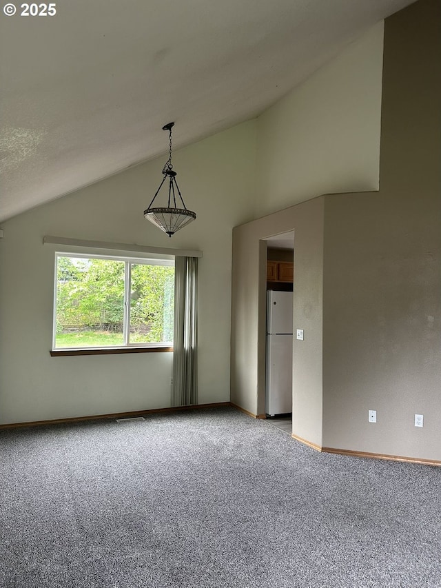 14237 SE Lee Ave, Milwaukie, OR 97267 - carpeted empty room featuring lofted ceiling and baseboards
