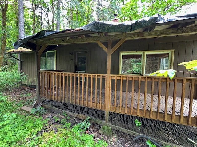 56294 Hall Dr, Mckenzie Bridge, OR 97413 - view of home's exterior featuring a chimney and a wooden deck
