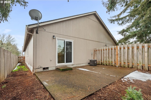 back of property featuring central AC unit and a patio area