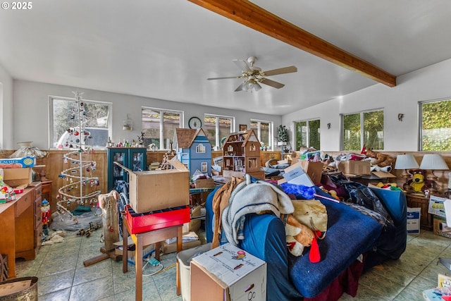 miscellaneous room with beamed ceiling and ceiling fan