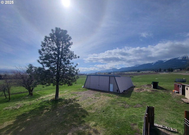 81202 Reavis Ln, Enterprise, OR 97828 - view of green lawn with an outbuilding, a rural view, and a mountain view