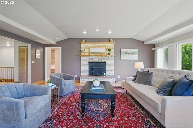 15960 SW Roshak Rd, Tigard, OR 97224 - living area featuring vaulted ceiling, a fireplace with raised hearth, recessed lighting, and baseboards