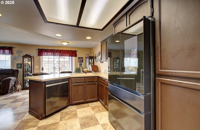 kitchen featuring kitchen peninsula and appliances with stainless steel finishes