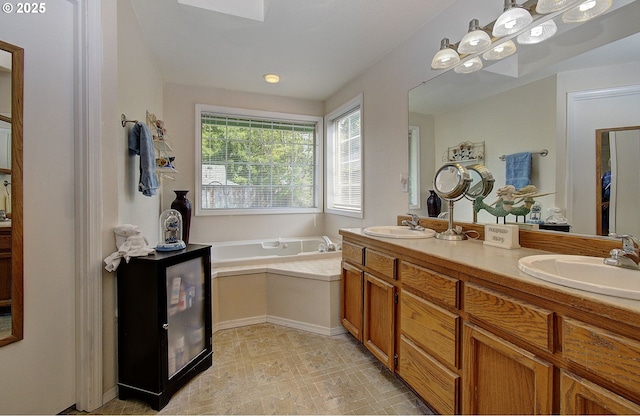 bathroom with vanity and a bathtub