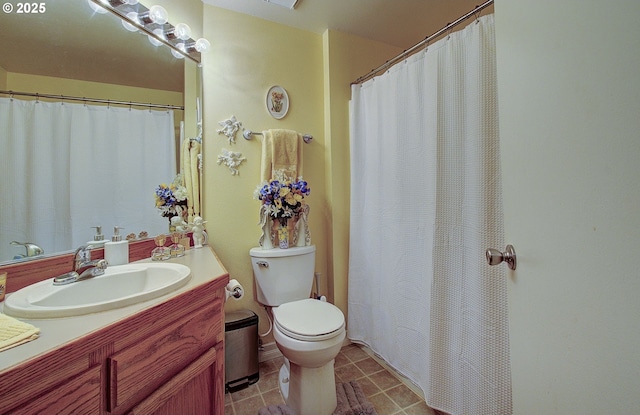 bathroom with toilet and vanity