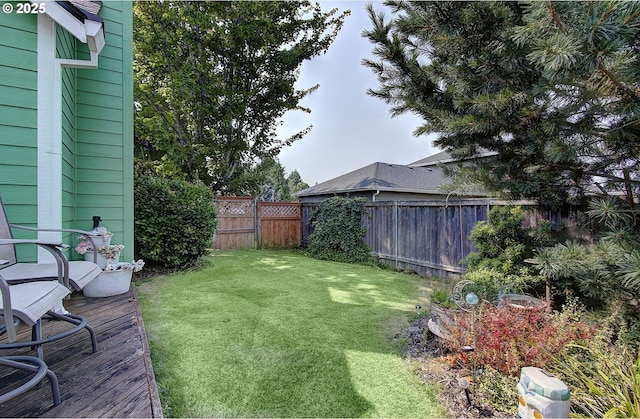 view of yard featuring a wooden deck