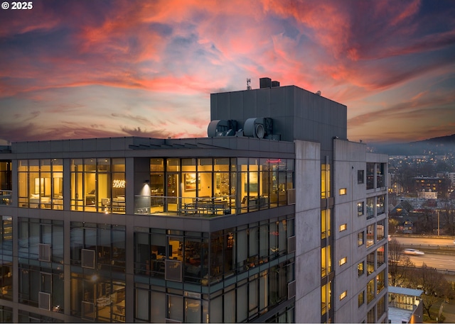 view of back house at dusk