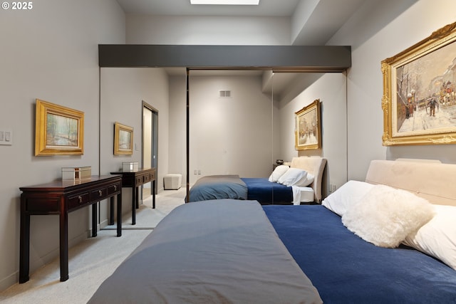 carpeted bedroom featuring a skylight