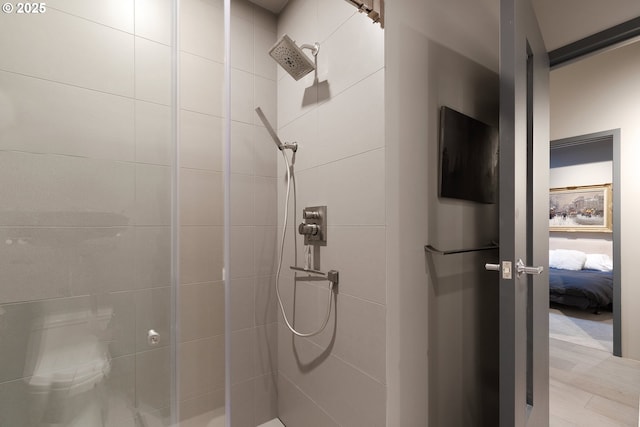 bathroom with tiled shower