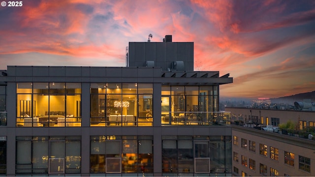 view of back house at dusk