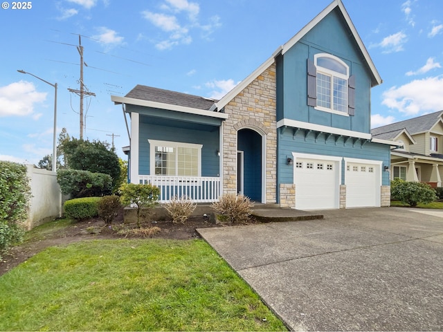 view of front of property with a front yard, fence, a porch, concrete driveway, and a garage